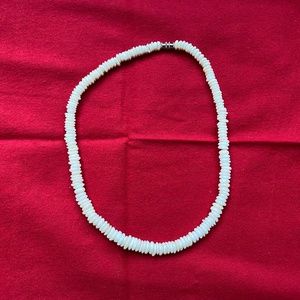 What shell necklace.